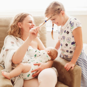 Breastfeeding mom baby and daughter